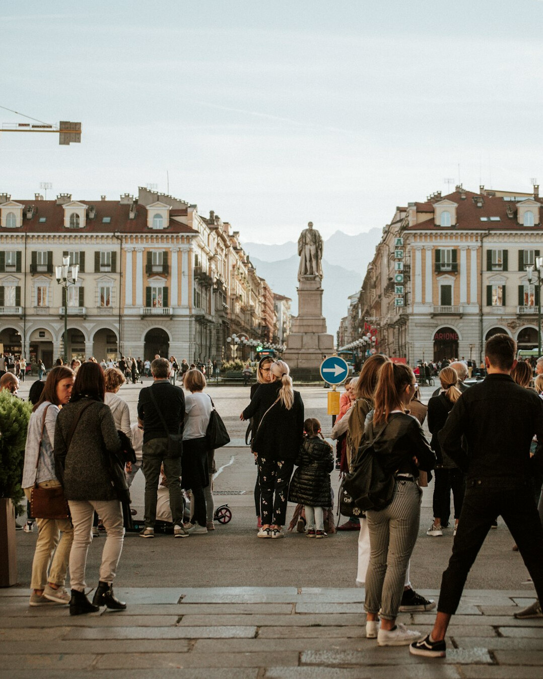 Documentary photographer taking photos of people in a town square