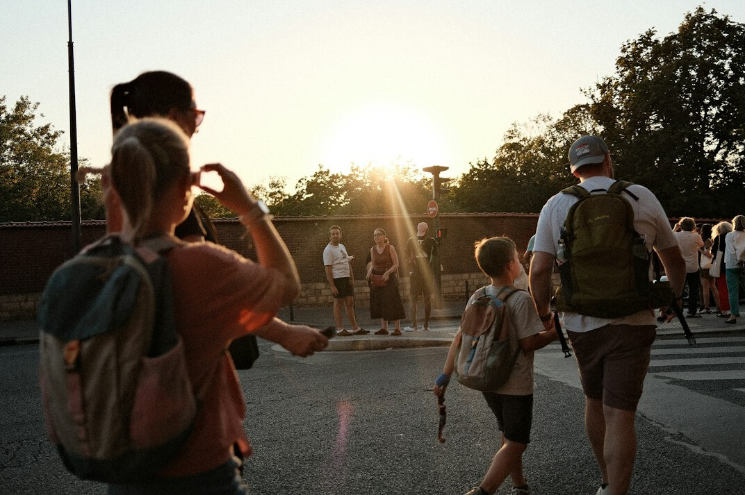 Group learning documentary photography outdoors with cameras